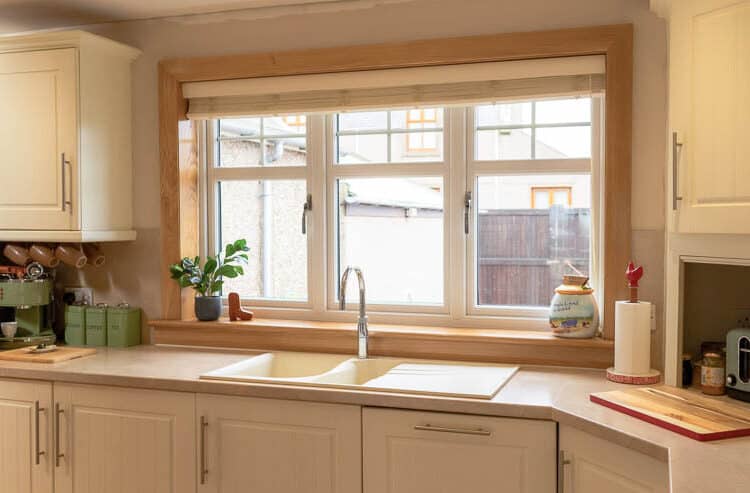 Internal view of white uPVC, double-glazed kitchen windows. Complete with Royal Oak sill and surroundings.