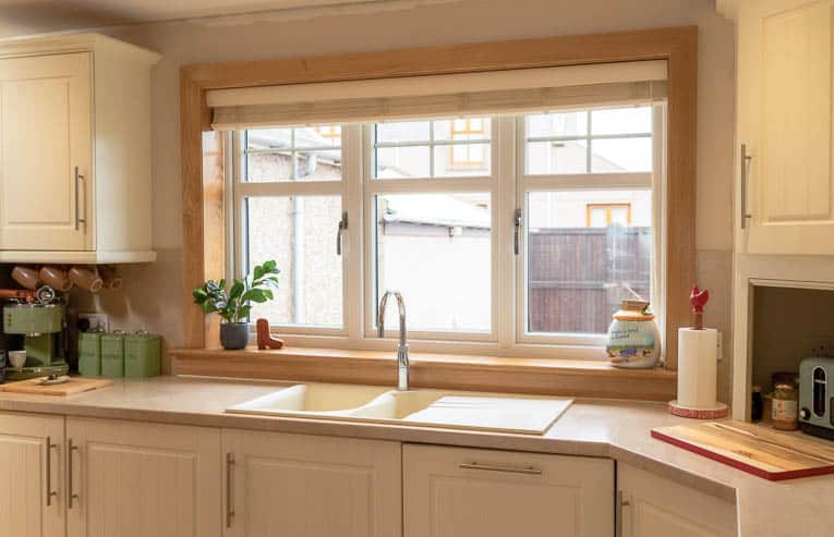 Internal view of white uPVC, double-glazed kitchen windows. Complete with Royal Oak sill and surroundings.