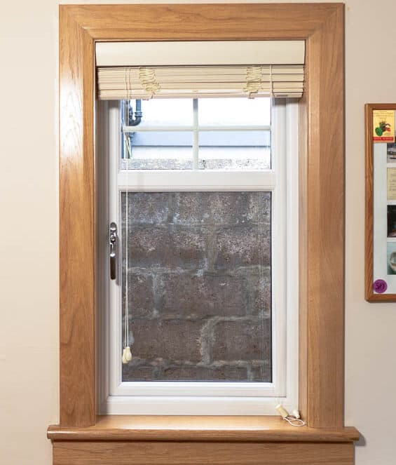 White casement window with royal oak timber sills and surrounds
