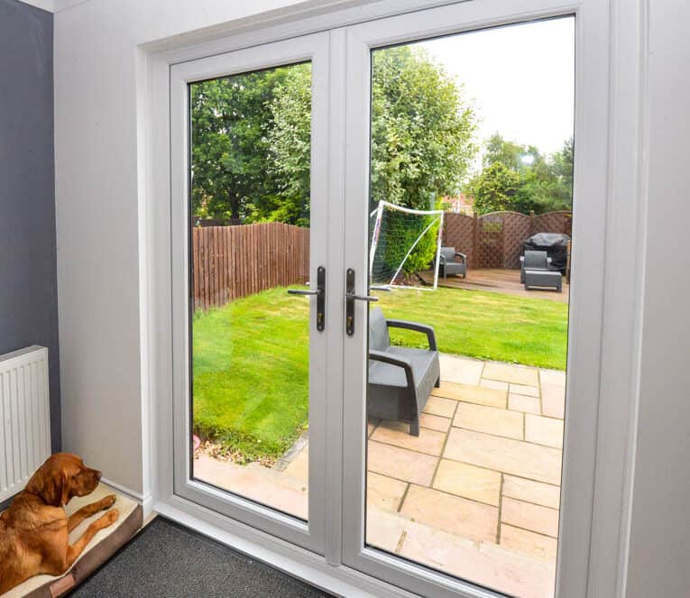 Internal view of white french doors with satin handles