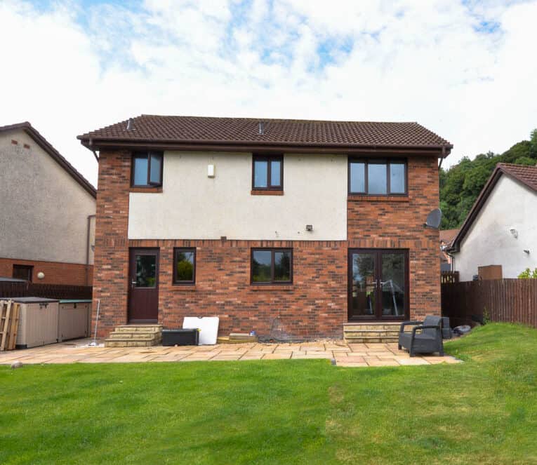 External view of home with rosewood french doors, back door and casement windows