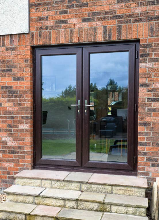 External view of rosewood french doors which open into the garden
