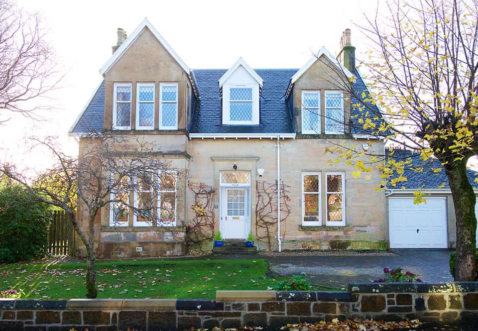 External view of victorian house in Milngavie with white sliding sash windows