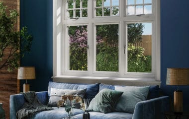 Blue living room with white 3 part casement window with white sills and surrounds