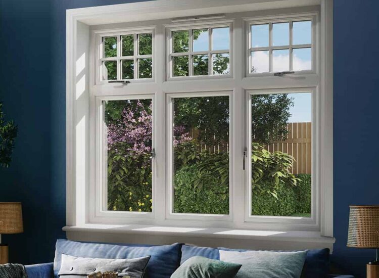 Blue living room with white 3 part casement window with white sills and surrounds