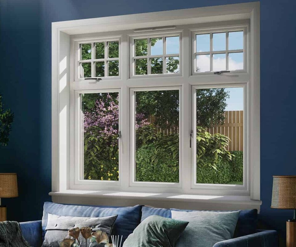 Blue living room with white 3 part casement window with white sills and surrounds