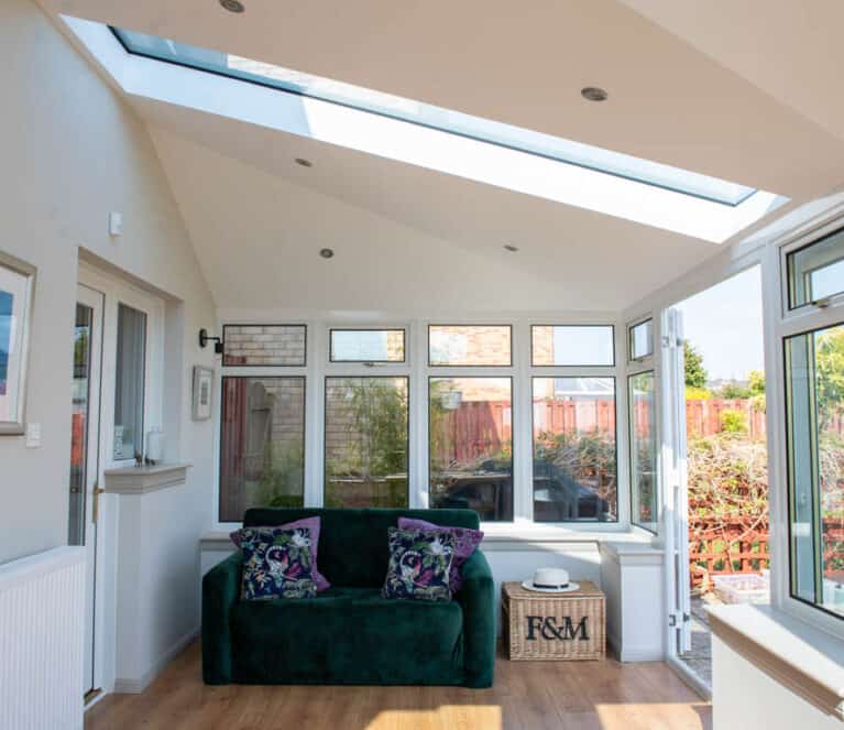 Internal view of conservatory with new solid roof and glazed roof panels