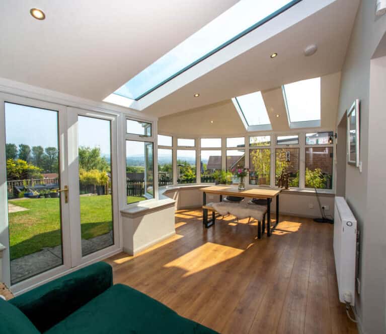 Internal view of conservatory with new solid roof and glazed roof panels