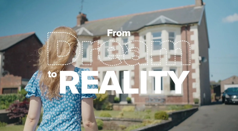 Woman walking towards a property