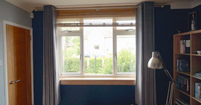 White casement window in living room with royal oak sills and surrounds