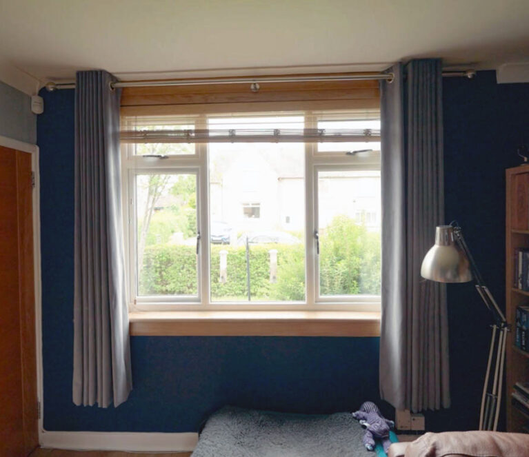 White casement window in living room with royal oak sills and surrounds