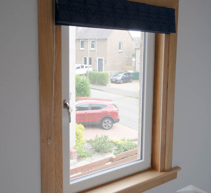 White tilt and turn window with royal oak sills and surround