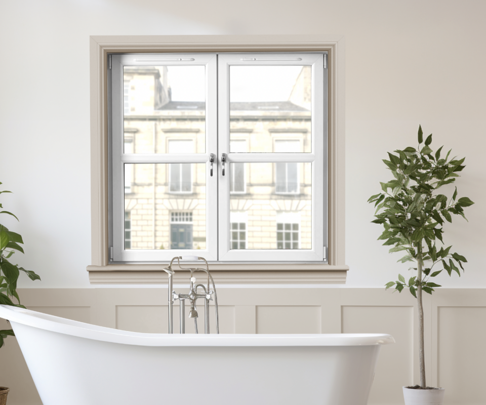 Bath under window overlooking Scottish architecture.