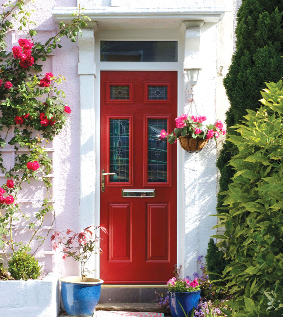 Cherry red front door, complete with lever handle, decorative glass inserts and stainless steel letterbox. From our timberLuxe range of composite doors.