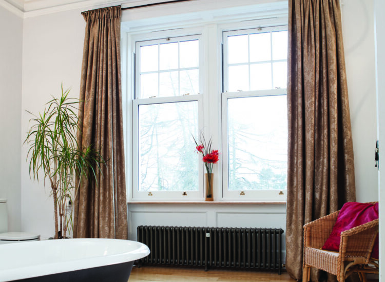 Interior shot of sliding sash uPVC windows. Positioned in a bathroom of a Glasgow home.