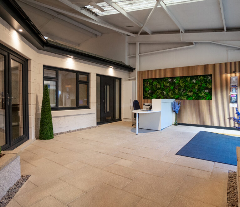 Reception area of the CR Smith showroom in Dunfermline, Fife. Showcasing a uPVC french door, uPVC double-glazed windows and a TimberLuxe composite door.