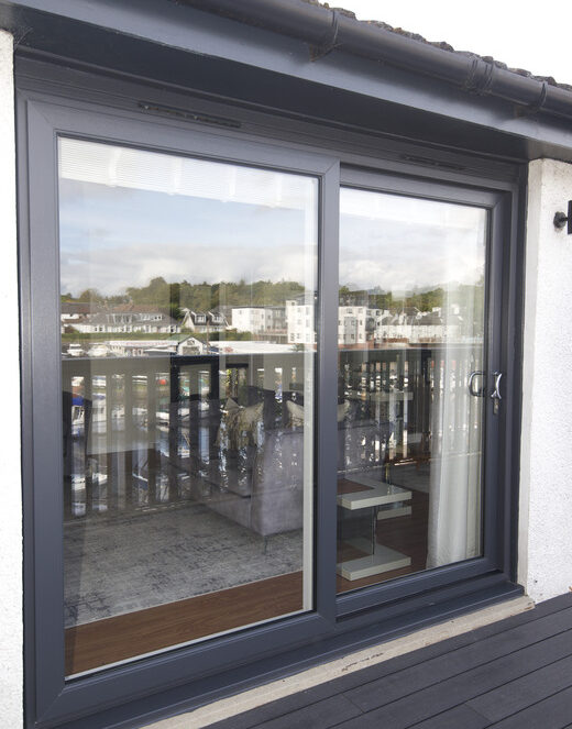Anthracite grey patio door complete with chrome handles.