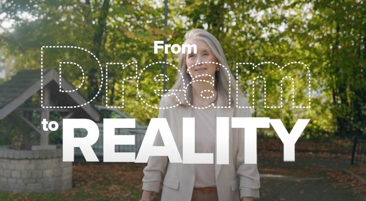 Blonde lady walking between trees. Dream to Reality written in bubbles across the screen