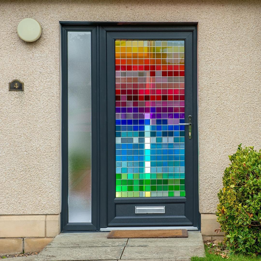 Bespoke stained glass design from CR Smith showcasing a mosaic effect of rainbow colours.