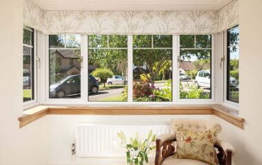 Internal image of a Lorimer casement window in white finish, with Georgian bars. Complete with a royal oak timber sill.