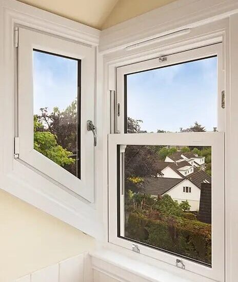 White Lorimer Sliding Sash window complete with white sills and surrounds in dormer.