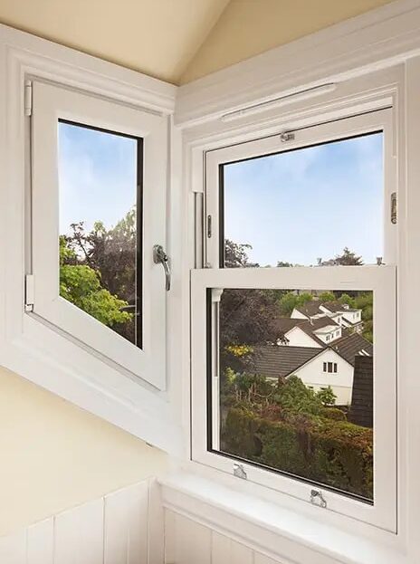 White Lorimer Sliding Sash window complete with white sills and surrounds in dormer.