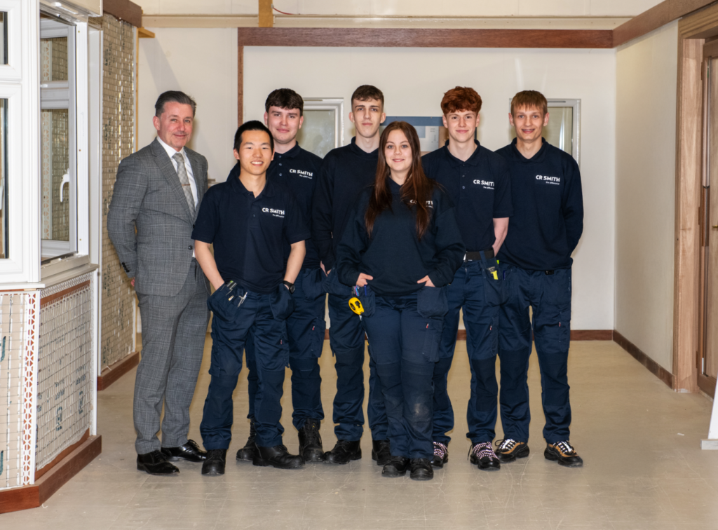 6 new CR Smith Apprentice Joiners with CR Smith Managing Director, Ian McFarlane, in the trianing room.