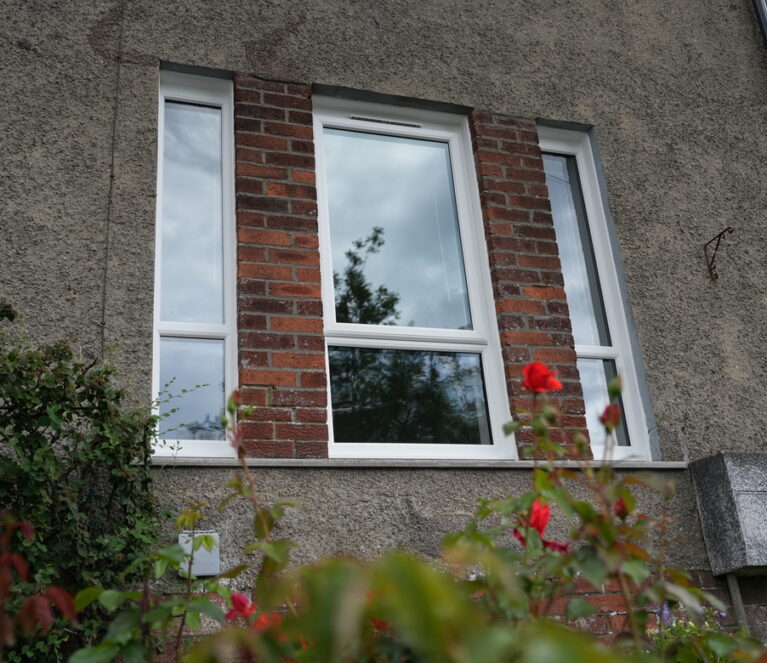 white Lorimer uPVC casement windows, complete with fixed panes