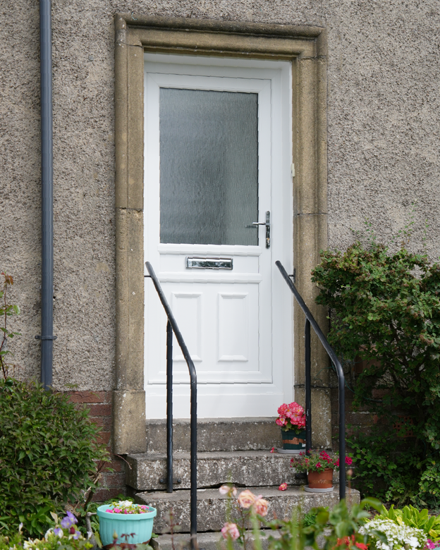 white uPVC Lorimer door complete with fronted glass pane and silver hardware