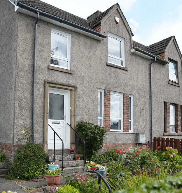 Full house exterior shot with new white Lorimer casement window and white uPVC front door.