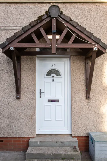 Upgraded Clydebank home with new white reversible windows and Georgian PVC door by CR Smith.