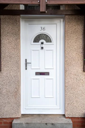 Upgraded Clydebank home with new white reversible windows and Georgian PVC door by CR Smith.