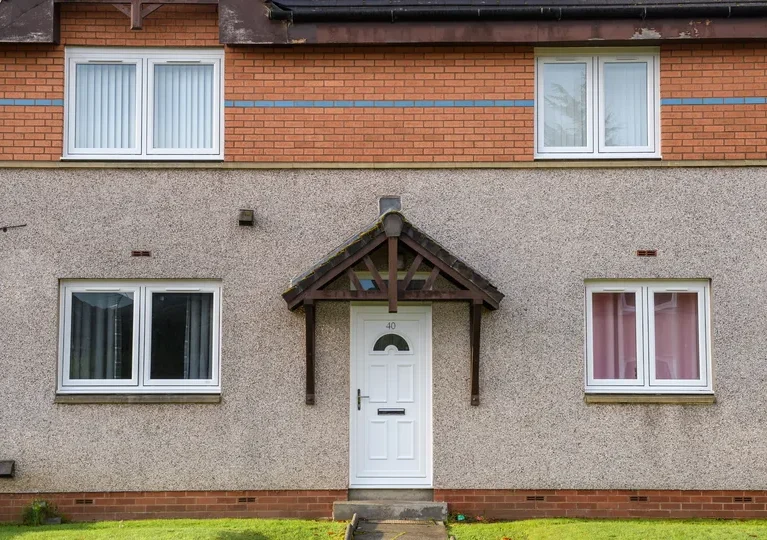 Upgraded Clydebank home with new white reversible windows and Georgian PVC door by CR Smith.