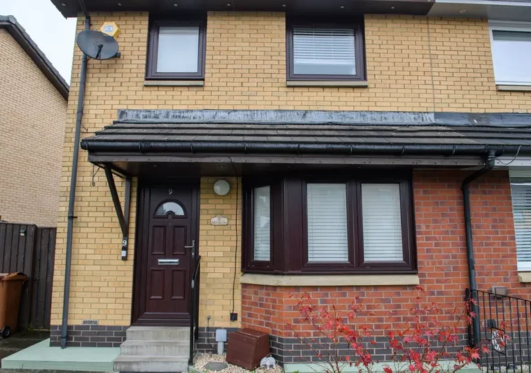Rosewood reversible Georgian PVCu windows by CR Smith for Wellhouse Housing Association