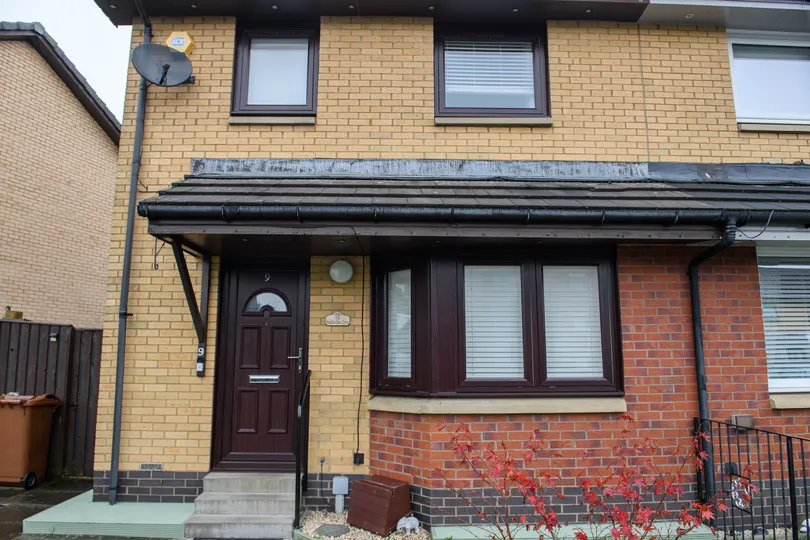 Rosewood reversible Georgian PVCu windows by CR Smith for Wellhouse Housing Association