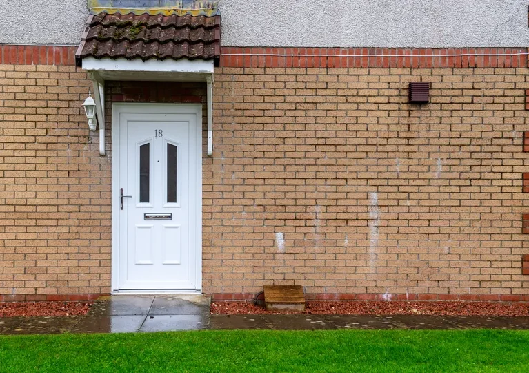 White PVCu back door by CR Smith for Wellhouse Housing Association