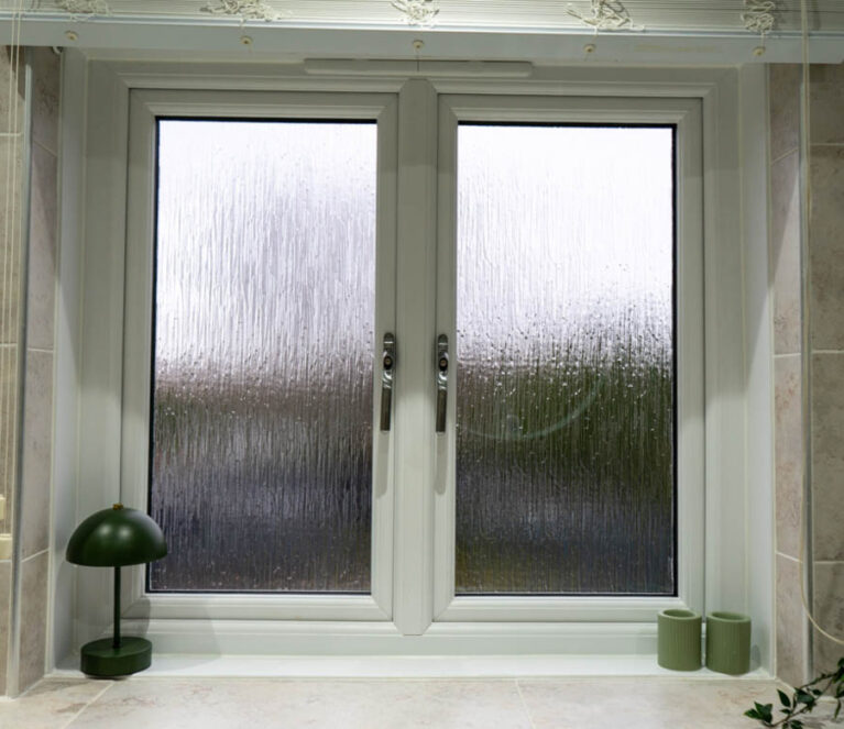 Interior view of white Lorimer casement windows installed in a bathroom in a home in Wishaw, Glasgow.