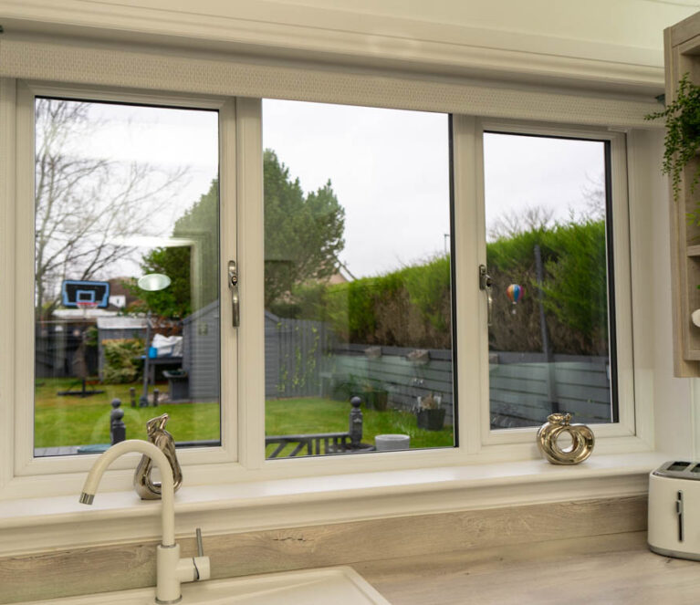 Interior view of white Lorimer casement windows installed in a kitchen in a home in Wishaw, Glasgow.