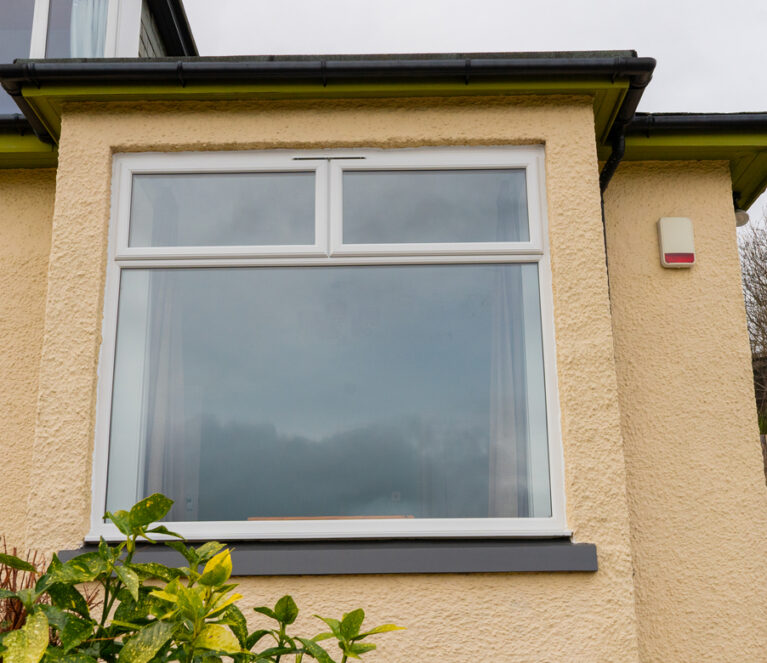 Exterior view of white Lorimer casement windows installed in Dundee