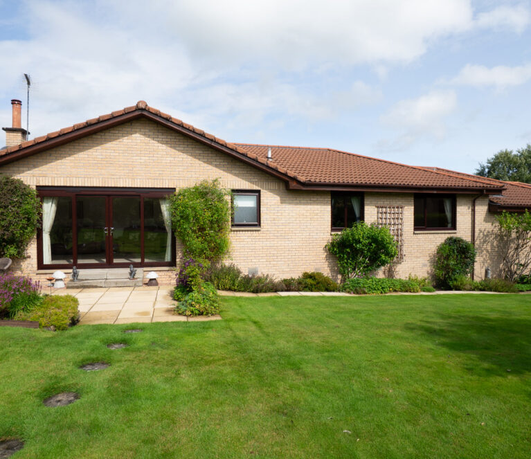 Rosewood Lorimer patio doors and casement windows installed in a home in Doune