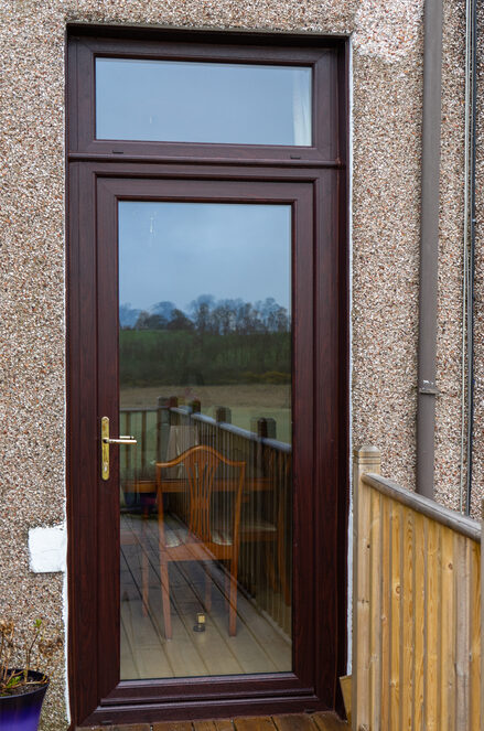 Exterior view of a rosewood Lorimer uPVC door installed in Fife.