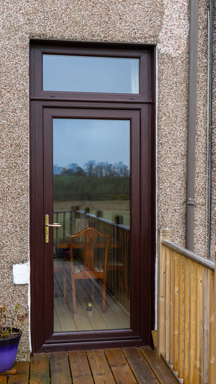 Exterior view of a rosewood Lorimer uPVC door installed in Fife.