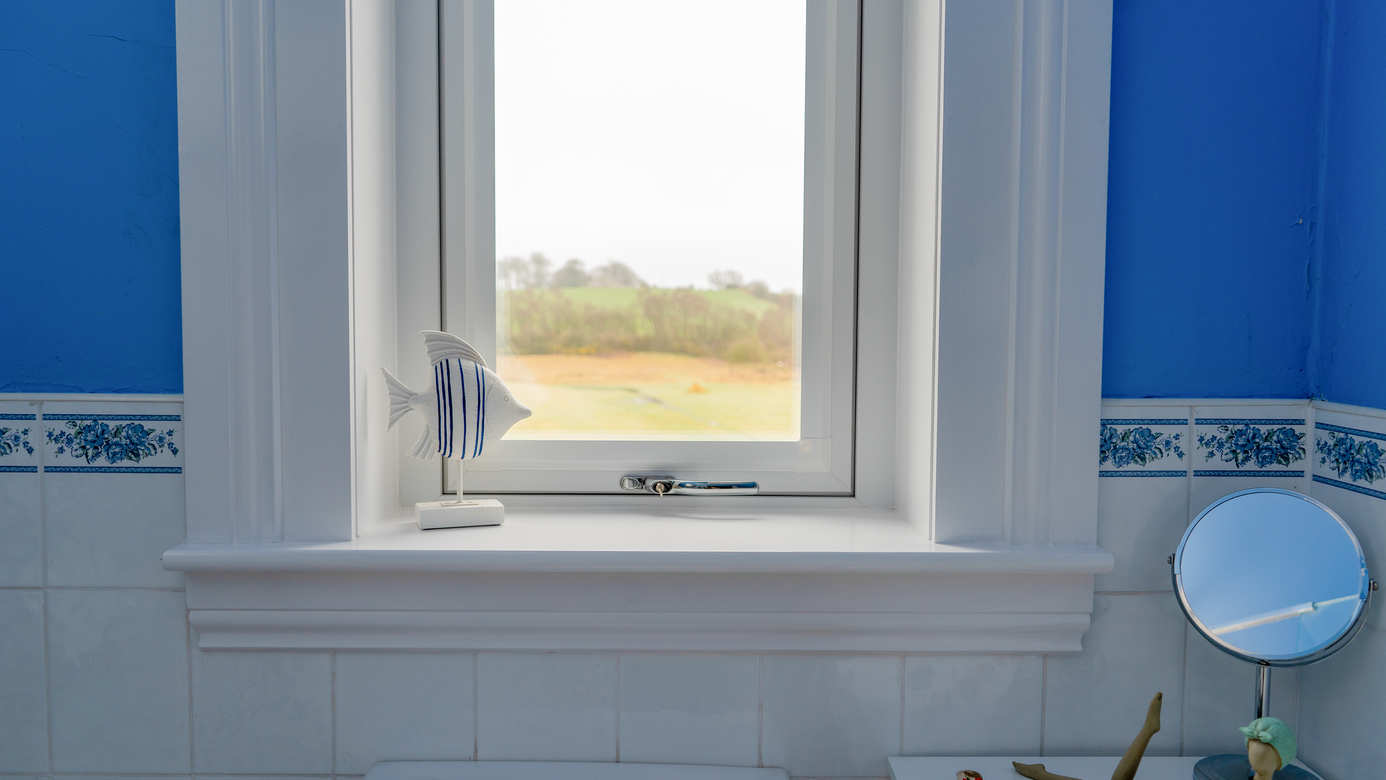 Interior view of a white Lorimer casment window installed in a bathroom in Fife