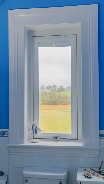 Interior view of white Lorimer casement window installed in a bathroom in Fife.