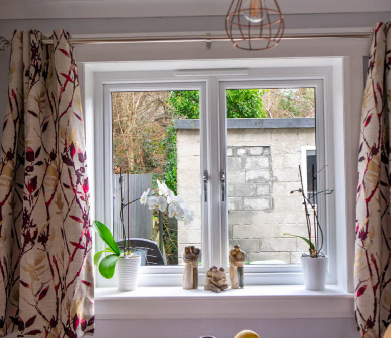 Internal view of white casement windows in dining room complete with white internal sills and surrounds.
