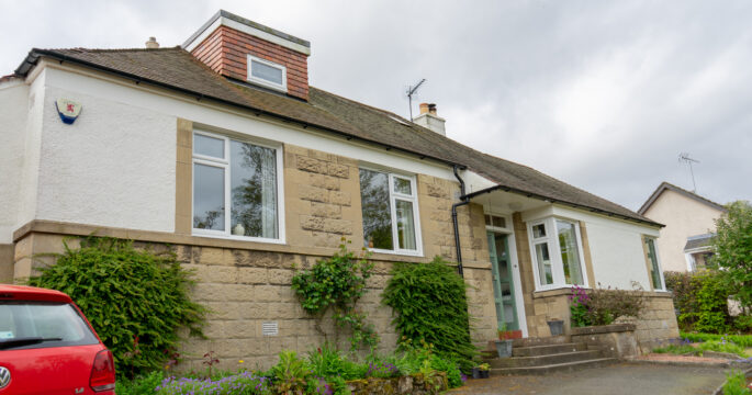 External full house view of Lorimer casement windows in Falkland home.